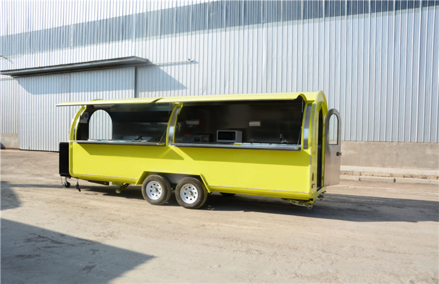 yellow pizza concession trailer with cooking equipment